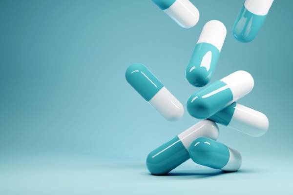 Pills against a blue background.