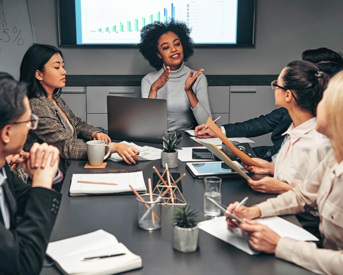 Work colleagues at a conference table in collaborative discussion