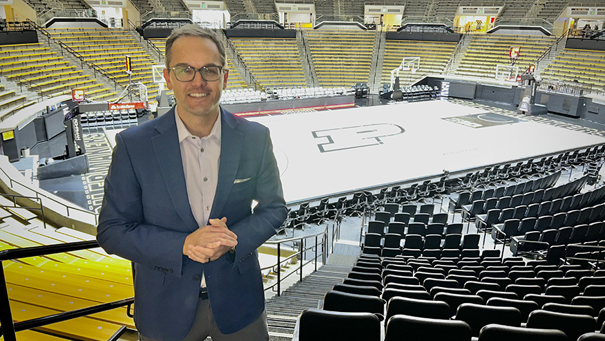 Pat Doney at Mackey Arena before Purdue Global’s commencement. Doney had previously covered a Purdue men’s basketball game while working in Louisville, Kentucky. (Photo provided)