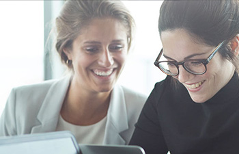 professional women looking at a laptop