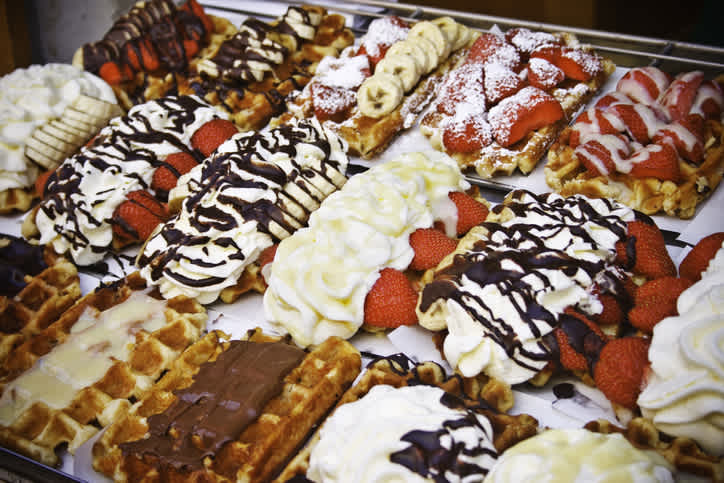 A gourmet waffle stand in Belgium, one of the sweet specialties to enjoy during your trip to Belgium.