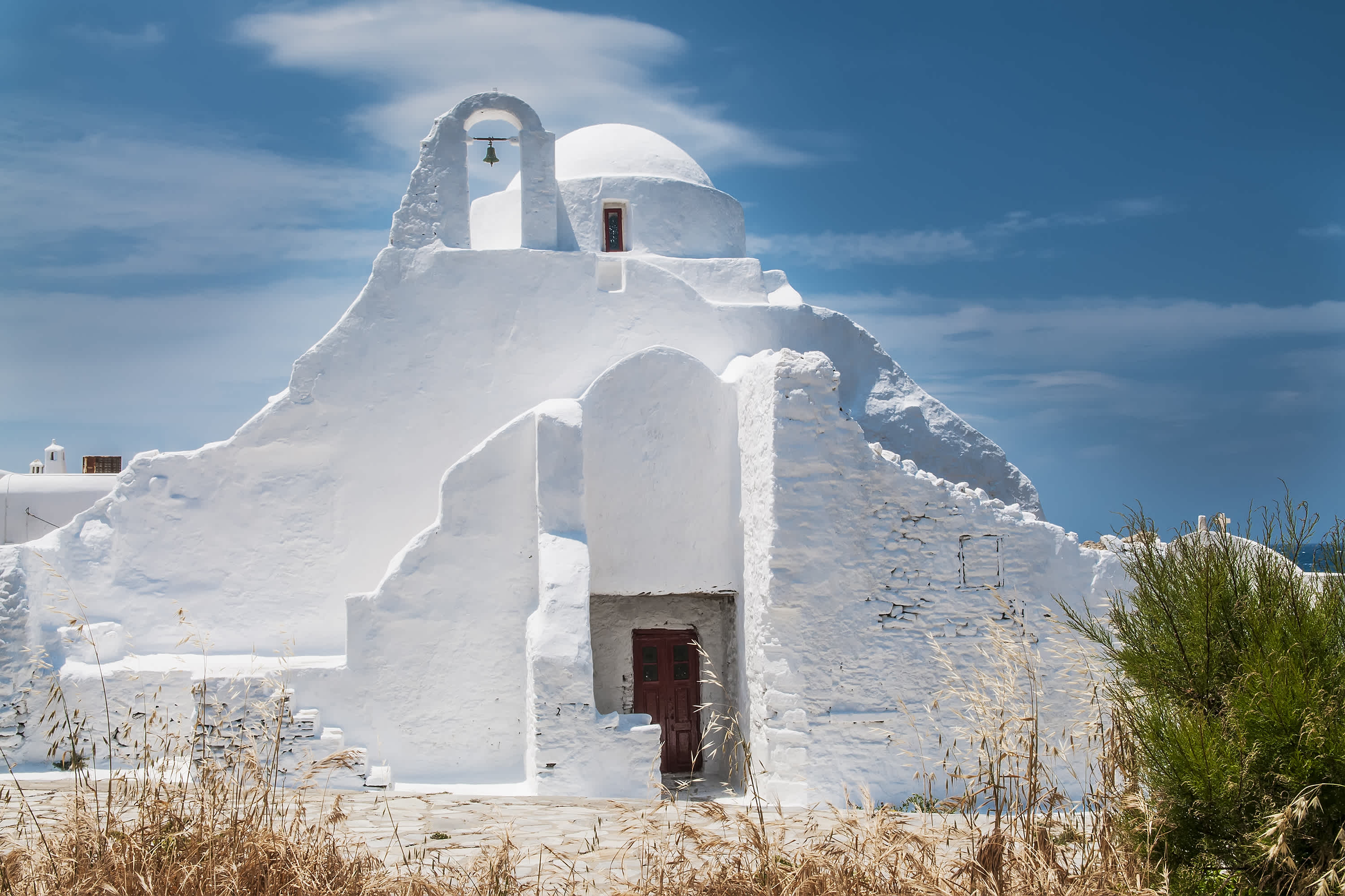 See beautiful churches on a Mykonos vacation