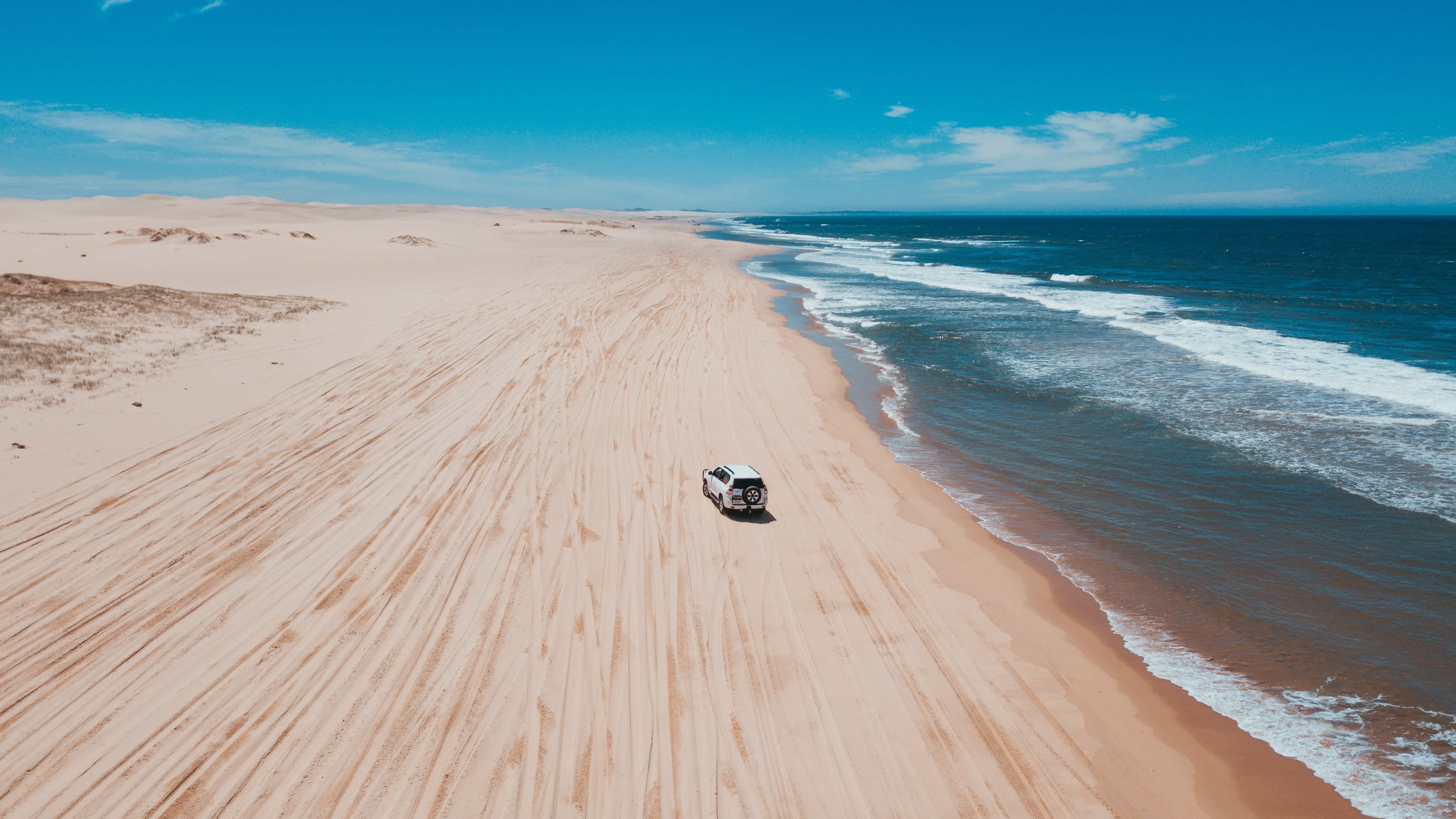Oceania, Australia, car driving down a beach