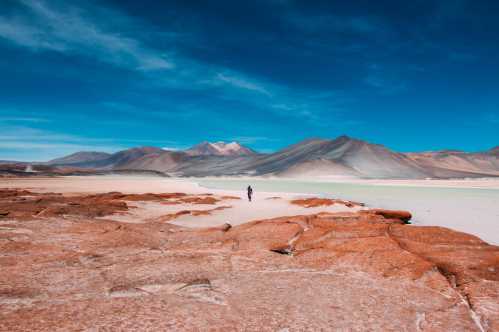 South America, Chile, the red rocks and blue sky of the Atacama Desert Salt flats.