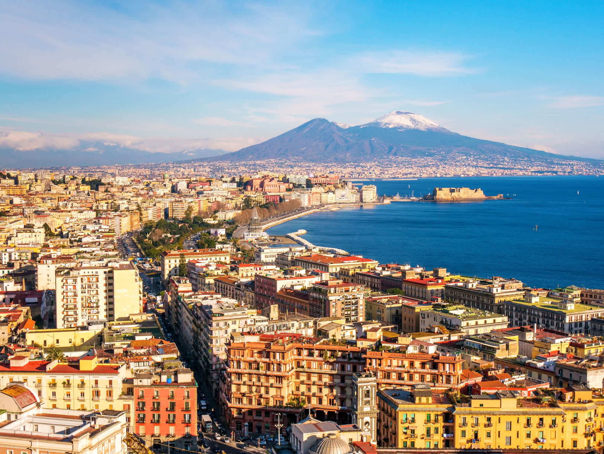 See Naples from above Naples, with the unusually snowy Vesuvius volcano in the background, on a Naples vacation