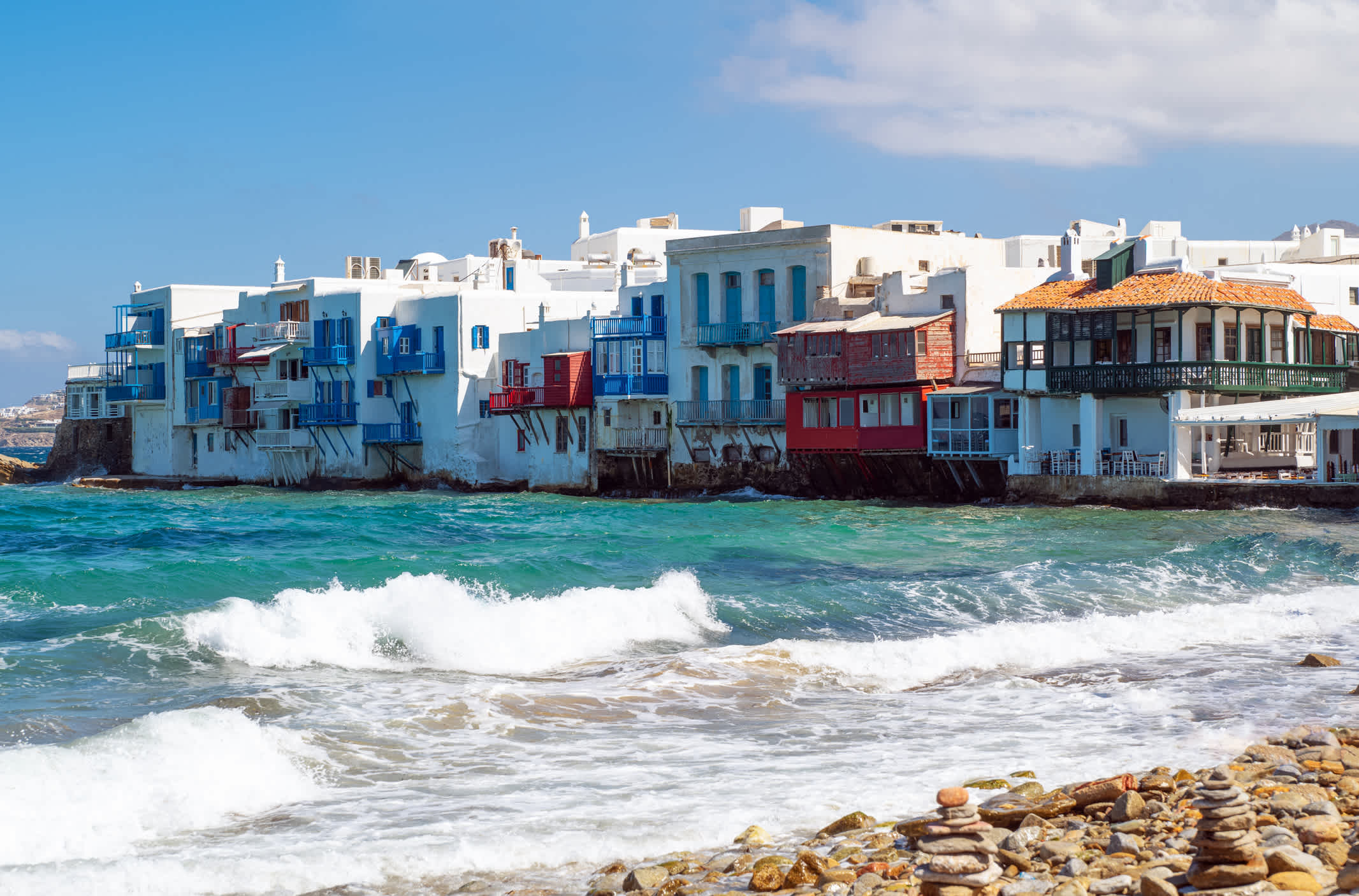 Little Venice is a beautiful place in Mykonos, next to the sea with a view of the windmills.