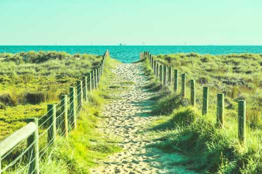 Sandy passage to St. Kilda Beach in Melbourne, Australia. 