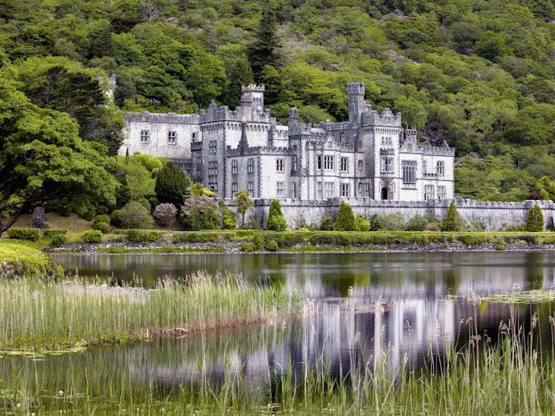 Manor house and abbey from the 19th century with beautiful garden. Kylemore Abbey, Donegal, Ireland.