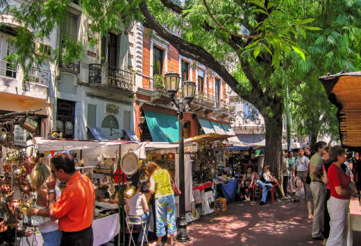 Tourists shop in San Telmo flea market in Buenos Aires old town