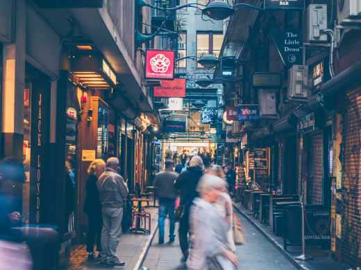 A laneway in Melbourne with restaurants and bars.
