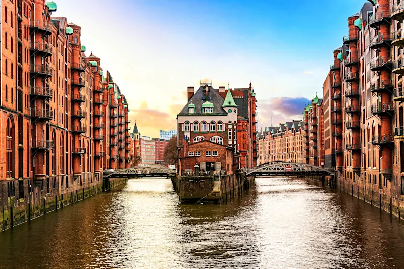 The Warehouse district Speicherstadt during sunset in Hamburg, Germany The Warehouse district Speicherstadt during sunset in Hamburg, Germany