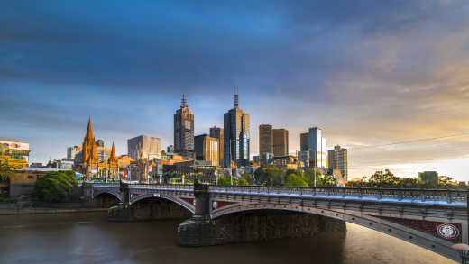 Oceania, Australia, Melbourne, frontlit view of the finders street station with a rose-colored sunset in the background.