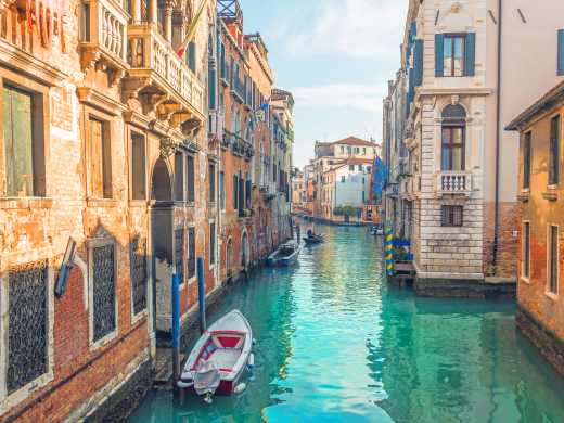 Discover beautiful canals and stunning architecture, pictured here, on a trip to Venice