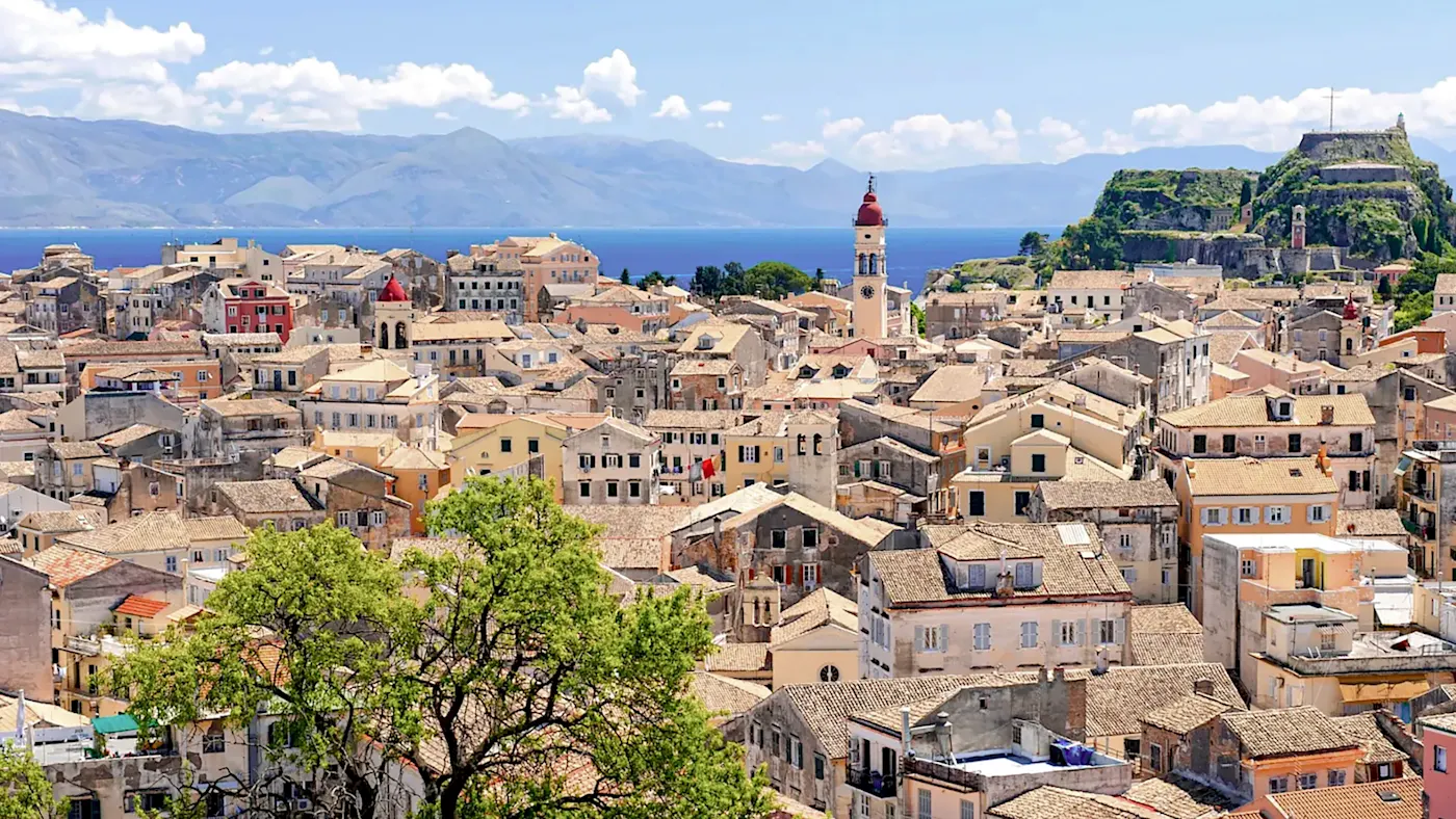 Picturesque coastal town of Corfu with colorful buildings and bell tower. Corfu, Greece.