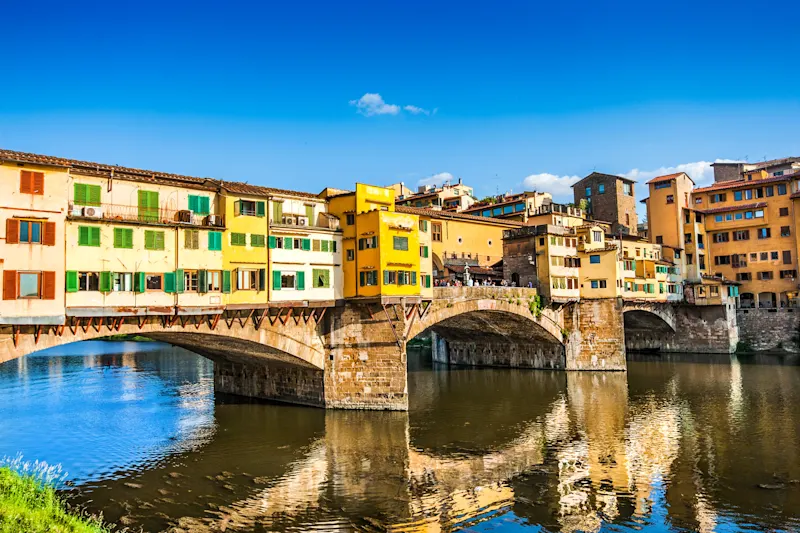 Ponte Vecchio with river Arno at sunset in Florence, Italy.