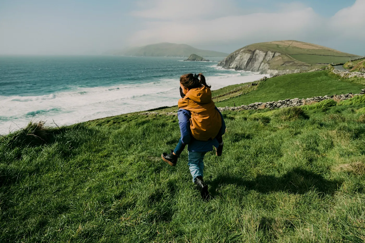 Father and son admire the landscape of Horn Head, Donegal, Ireland.

