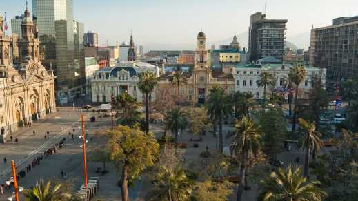 South America, Chile, Santiago de Chile, Plaza de Armas viewed from above, gentle sunlight and palm trees.