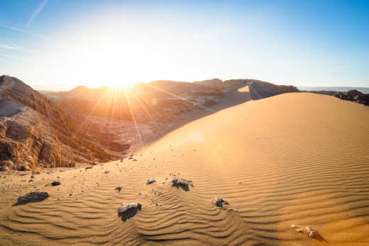 Stunning sunset on sand formation at " Valle De La Luna " mountains in Atacama desert