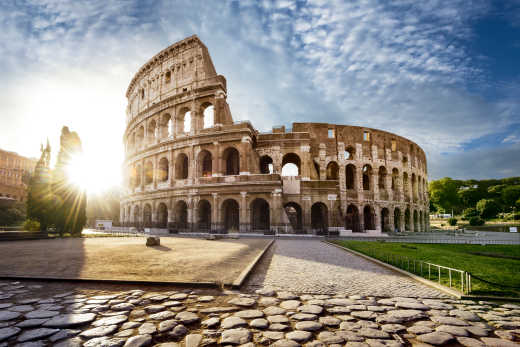 Discover the Colosseum, here pictured against a blue sky, on a Rome vacation