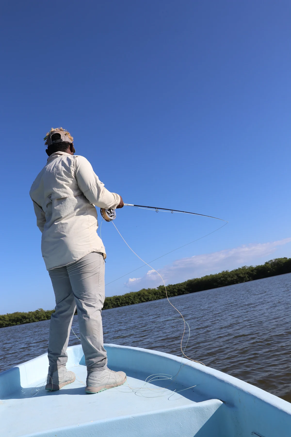 Fly fishing on a boat in Belize