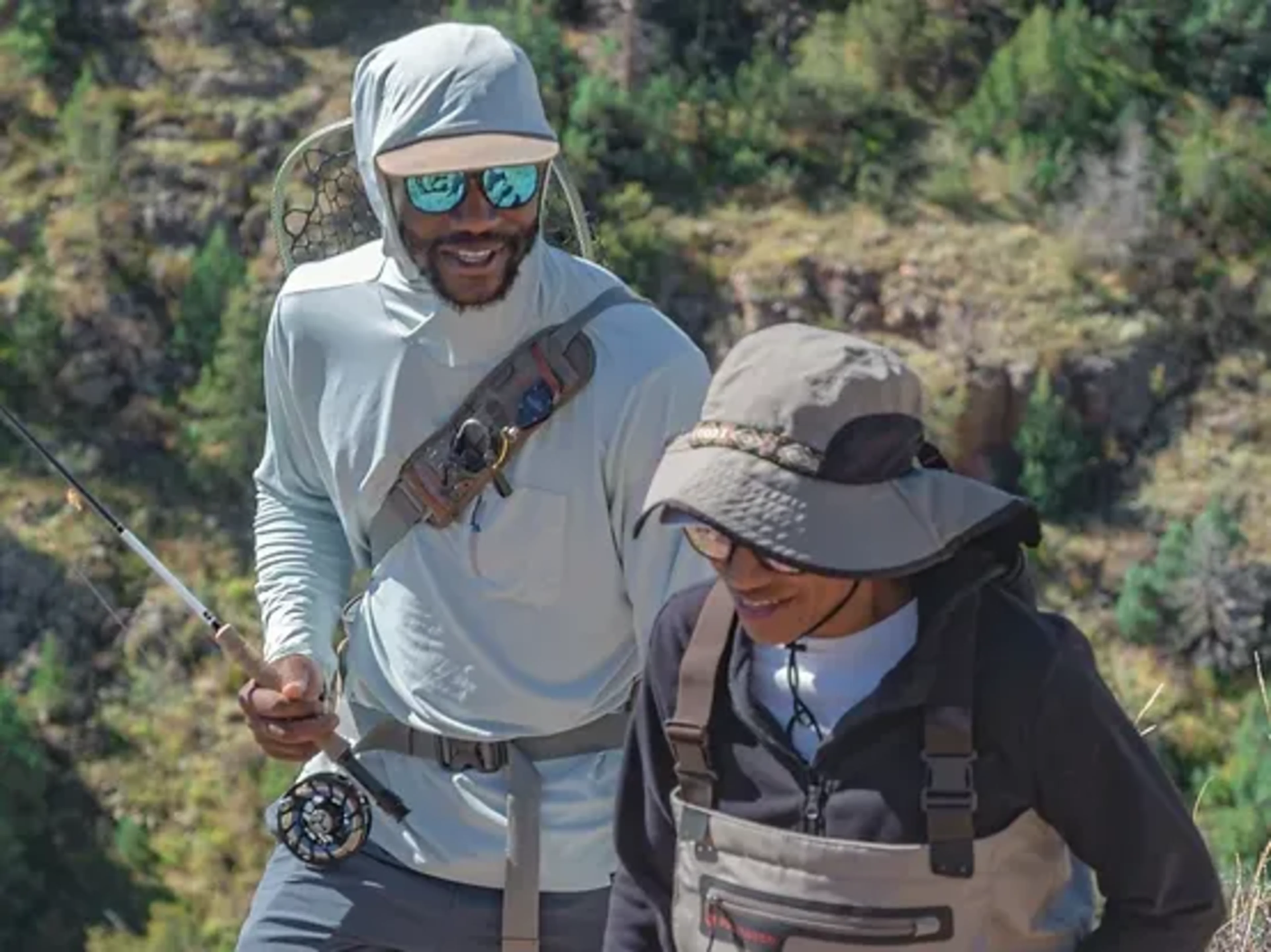 Two people talking to each other while hiking