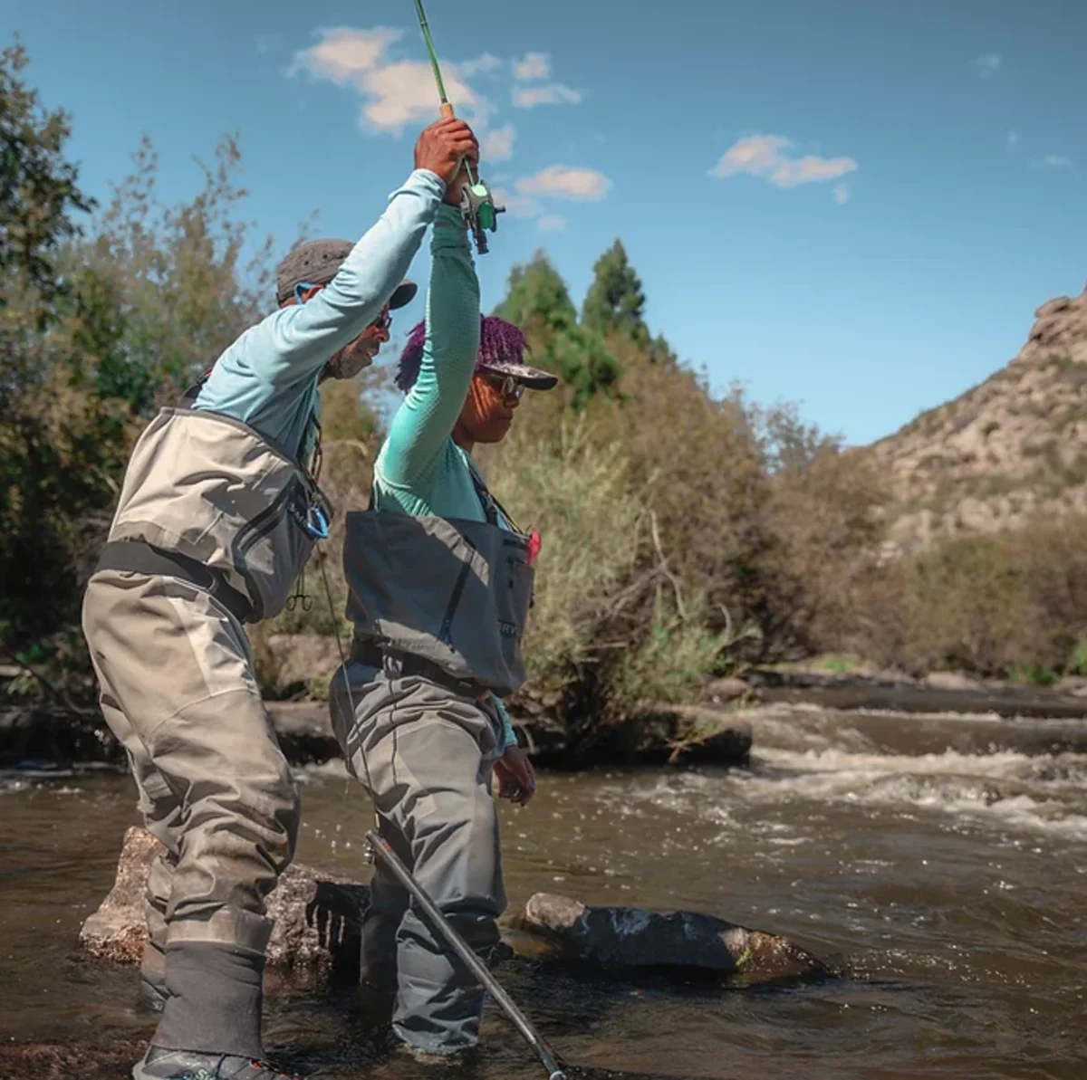 Person teaching another person how to cast
