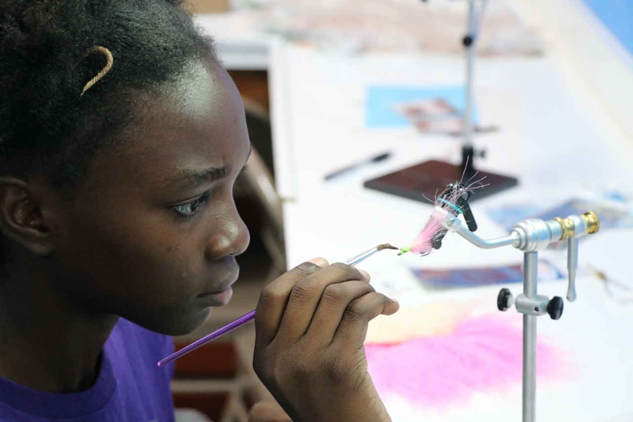 Closeup of a teen preparing a fly