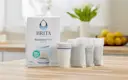 Brita® Refillable Water Filtration Starter Kit with 1 Reusable Filter Shell and 3 Filter Refills shown on kitchen island.