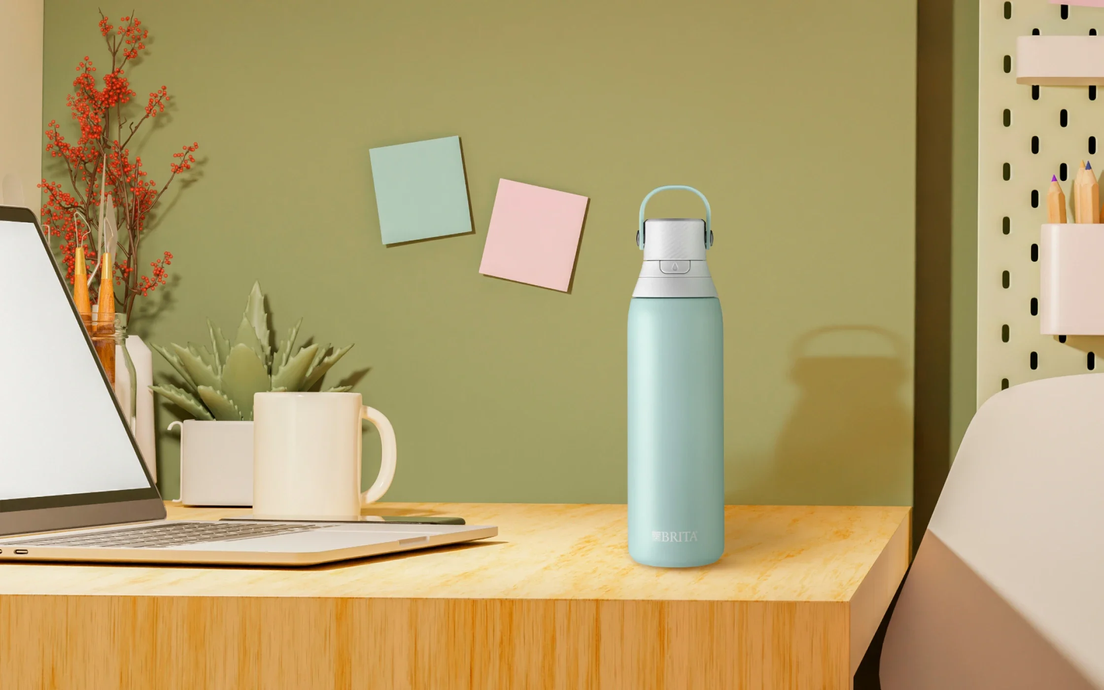 Stainless, Glacier-colored, 20oz premium filtering water bottle on desk in dorm room.