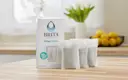 Brita® Refillable Water Filtration System Filter Refills, 3 Count, placed on kitchen island.