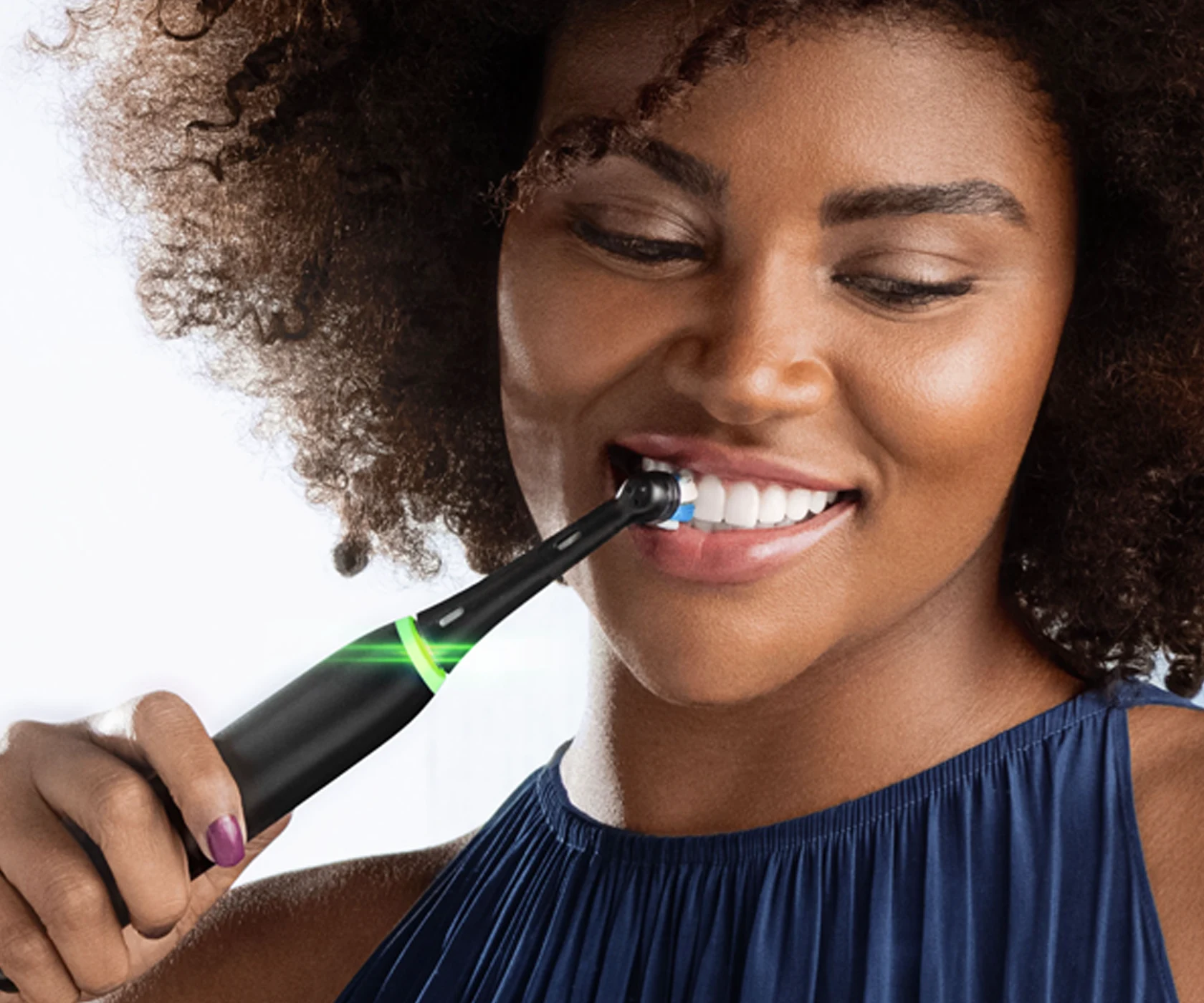 brushing teeth with electric toothbrush 