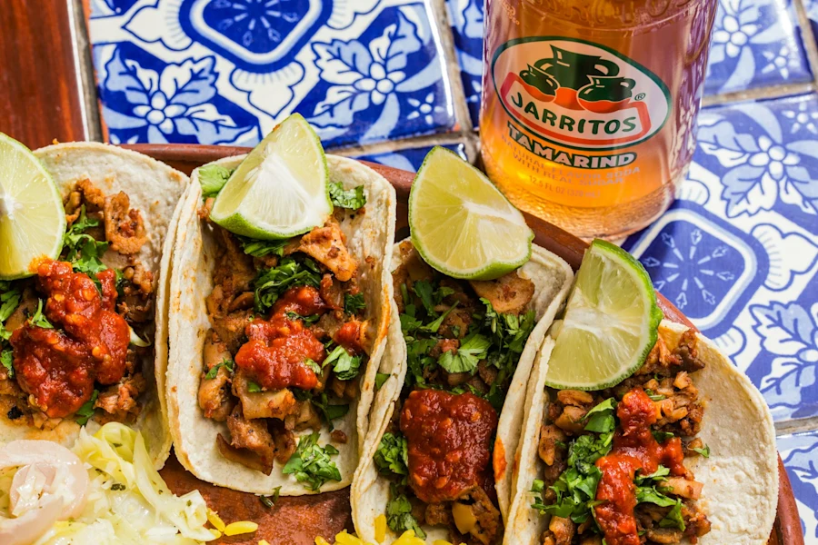 Three delicious tacos and a bottle of Jarritos