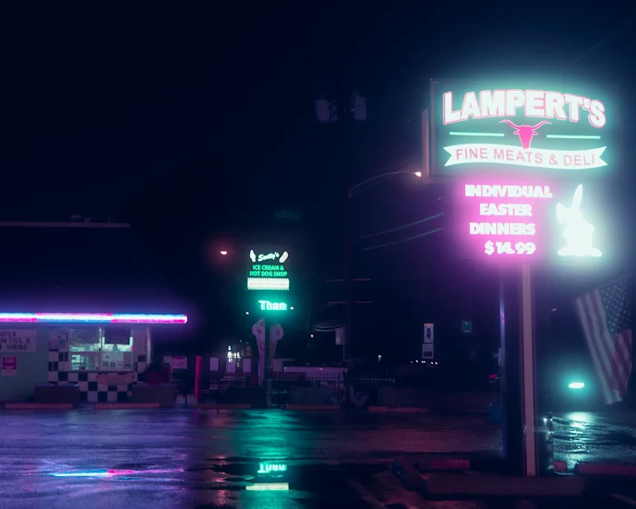 The neon sign of a diner at night