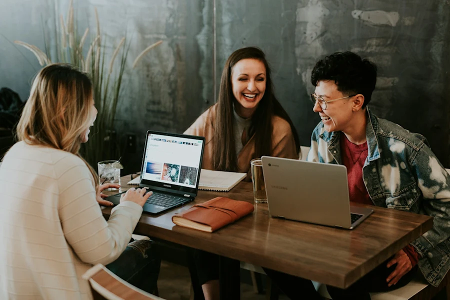Three people chatting in a coffee shop