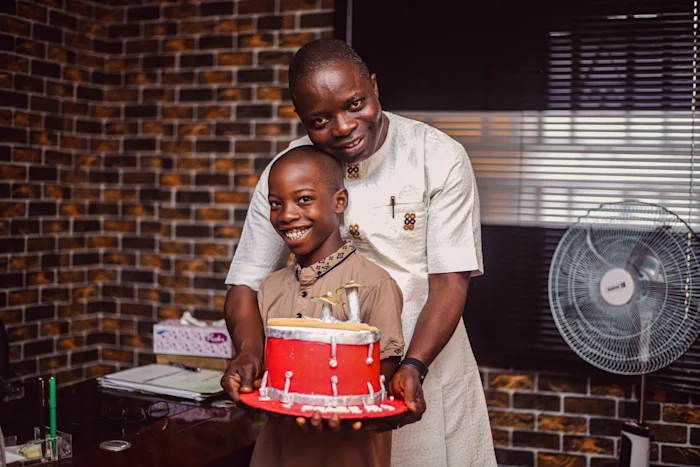 A father and a son celebrating the son's brithday
