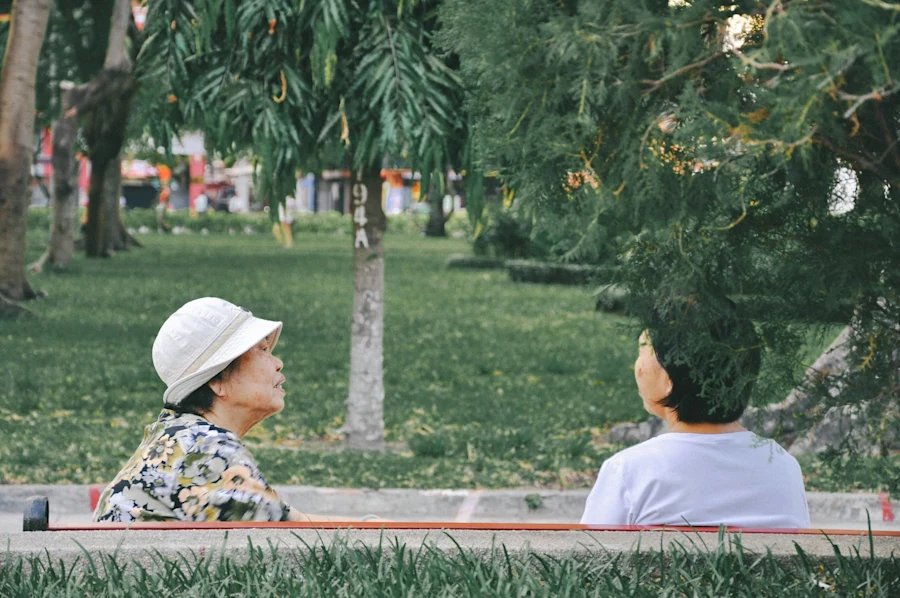 Two elderly women looking at each other