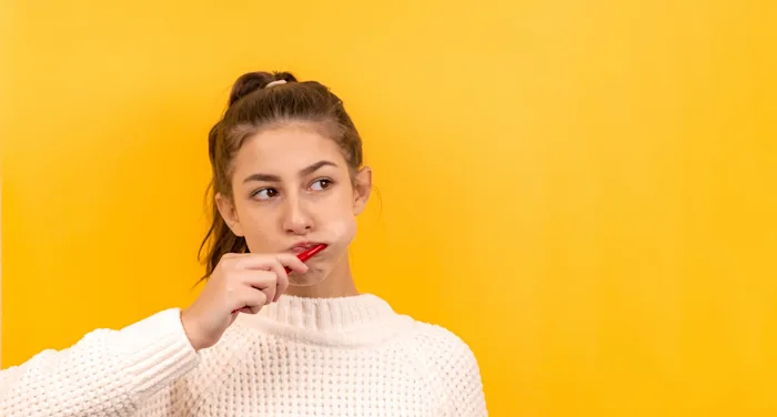 A woman brushing her teeth