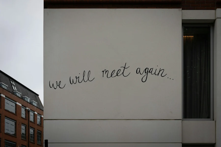 Wall graffiti that reads we will meet again