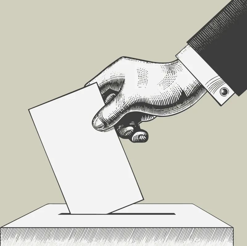 A hand casting a voting ballot