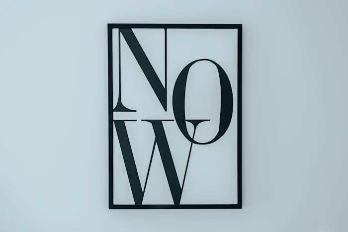 Art on a wall saying NOW
