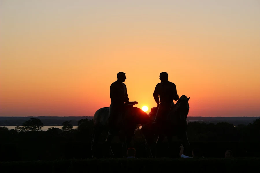 Two men riding horses