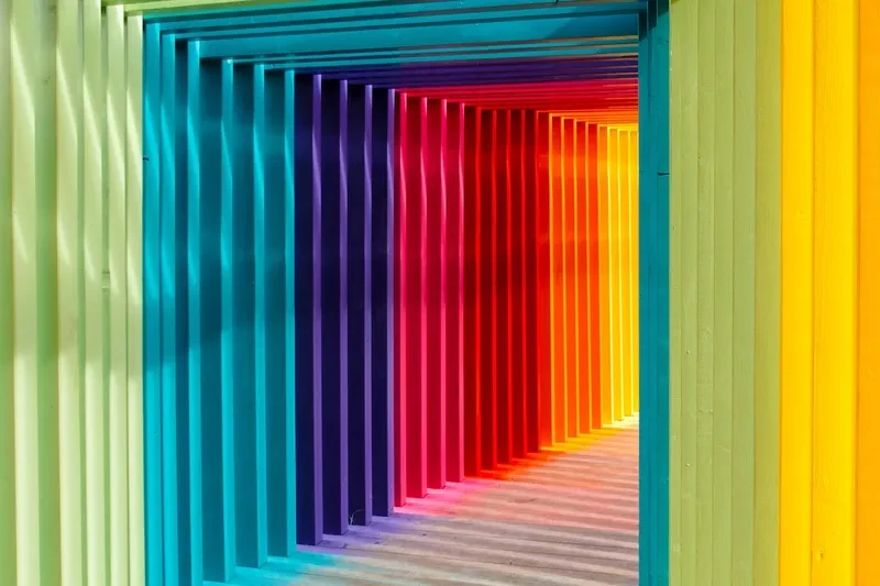 An arch made with beams of many colors