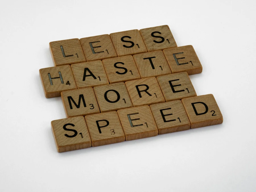 Scrabble letters saying less haste more speed