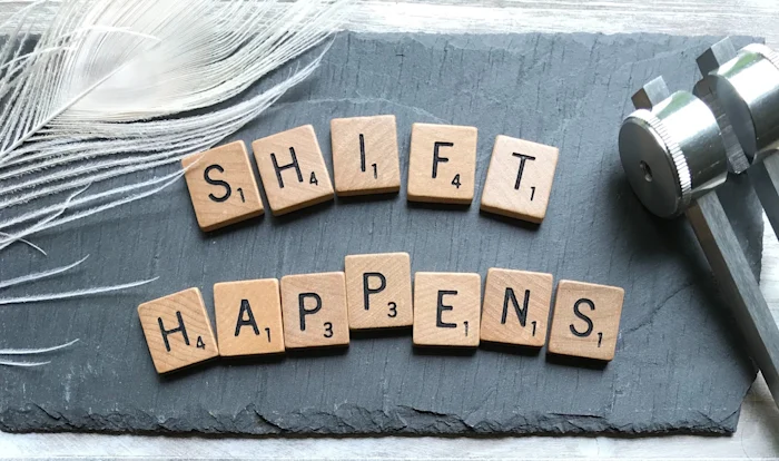 Scrabble letters saying SHIFT HAPPENS