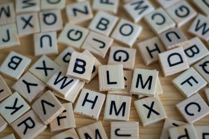 Scattered wooden blocks with letters