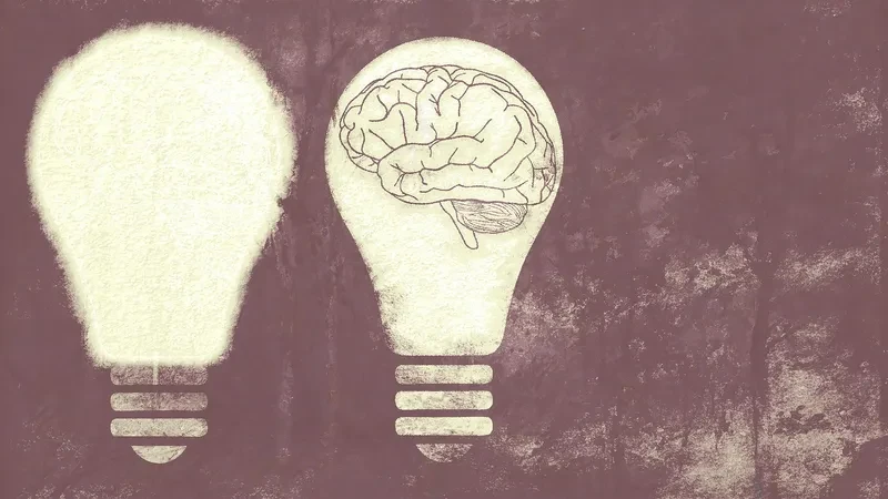 Two light bulbs, one of them with the image of a brain