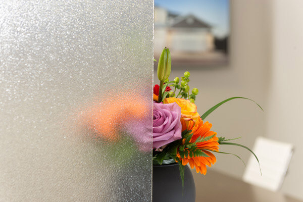 A example of the difference that Glue Chip glass finish can have on the look and privacy of your windows.