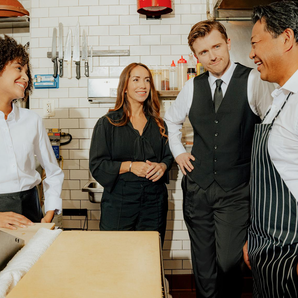 We’re revolutionizing hospitality by connecting businesses and talent to unlock new opportunities, optimize efficiency, and achieve superior outcomes (Image of manager training staff)