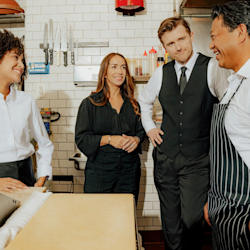 We’re revolutionizing hospitality by connecting businesses and talent to unlock new opportunities, optimize efficiency, and achieve superior outcomes (Image of manager training staff)