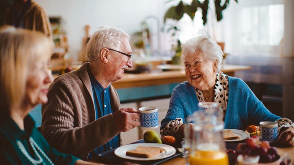 Server bringing food to a retirement community member